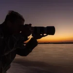Guest-with-camera-gear-on-safari-in-Botswana-Pangolin-Photo-Safaris-scaled